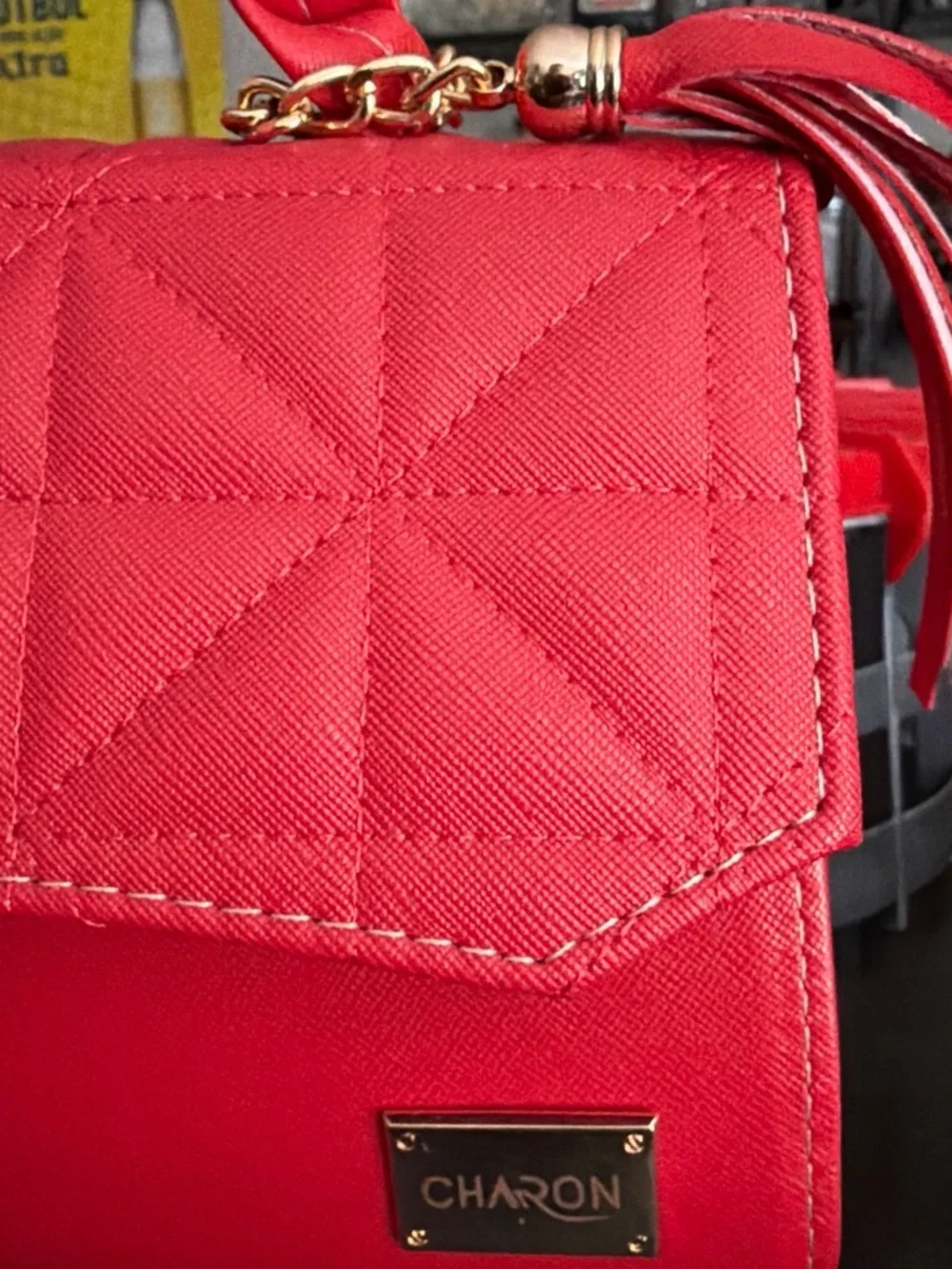 Quilted Red Crossbody Bag with Braided Handle and Tassel